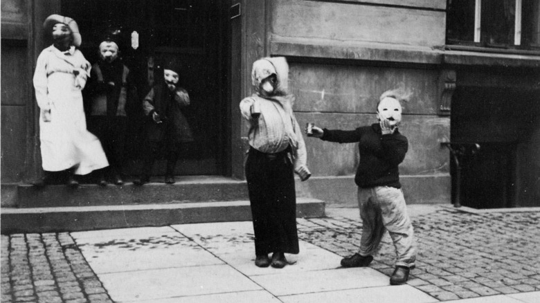 Children with rattle boxes preparing to collect money and treats on Fastelavn (the children's carnival)