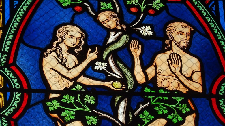 Stained glass of Adam and Eve with serpent
