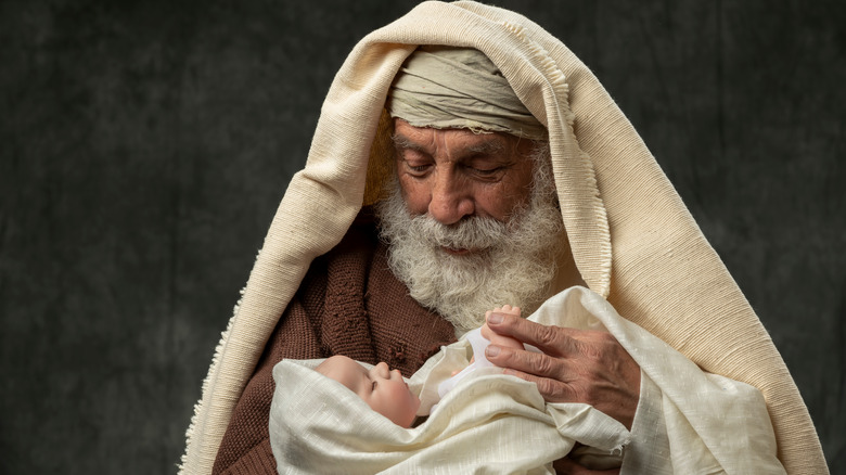 Jewish man holding baby Jesus