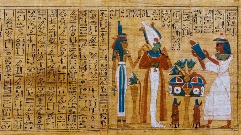 Ancient Egyptian papyrus with many hieroglyphs 