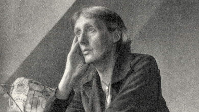 Virginia Woolf sitting at desk