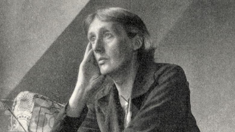 Virginia Woolf sitting at desk