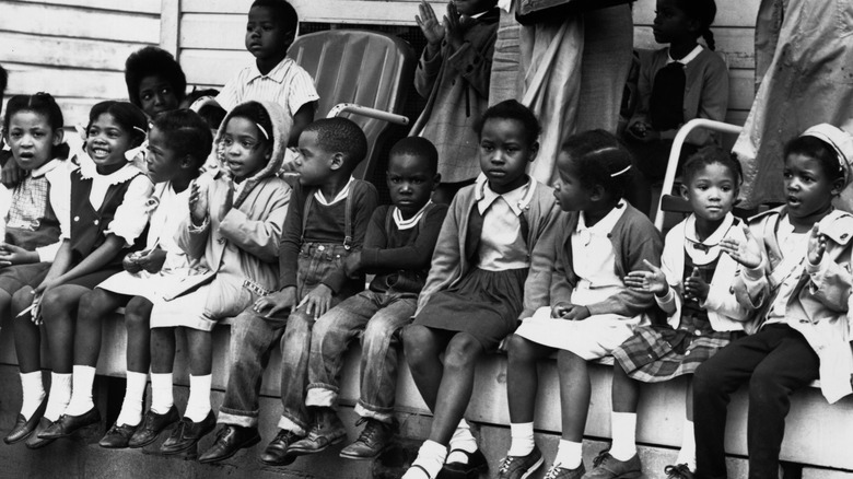 Children watching a black voting rights march in Alabama.