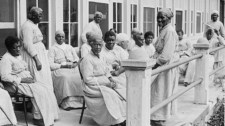 slave men and women on a porch