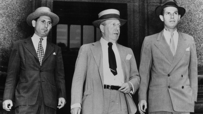 Alger Hiss leaving court with his attorneys