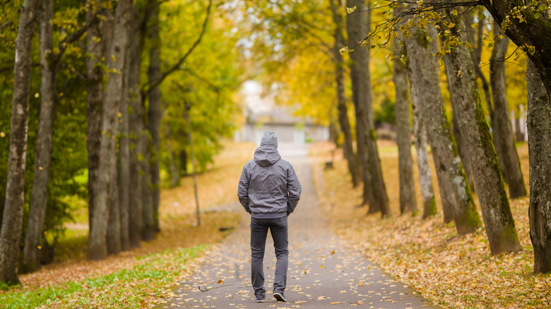 Man walking in gray hoodie