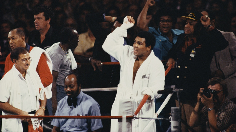 Muhammad Ali raises fist