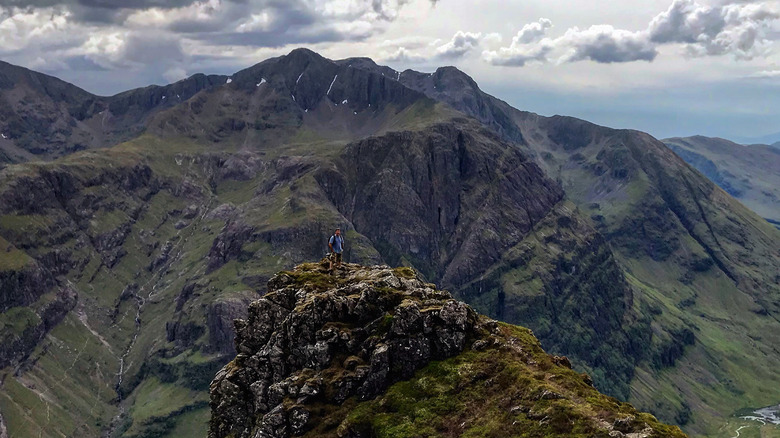 hiker Aonach Eagach ridge scotland