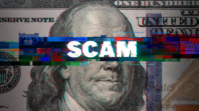 Scam written on dollar bill