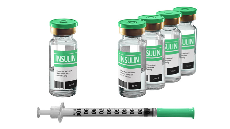 Vials of insulin with syringe