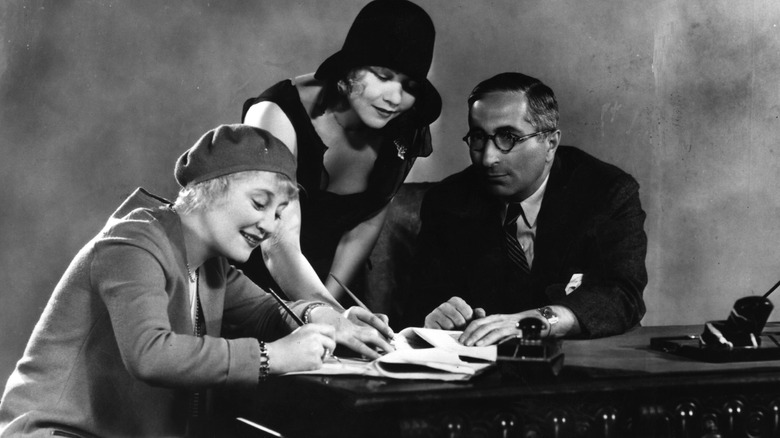 Rosetta and Vivian Duncan signing a contract with Louis B. Mayer