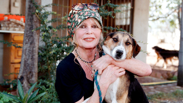 Brigitte Bardot hugging her dog