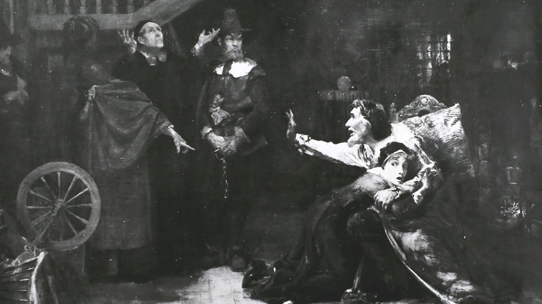 Woman being accused of witchcraft