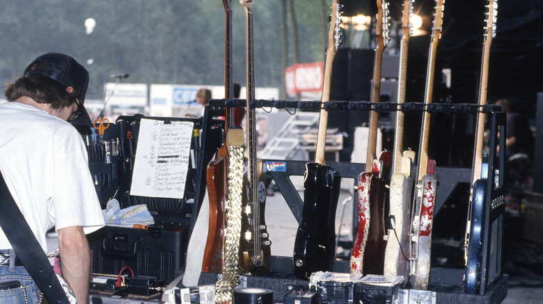 Roadie prepping Sonic Youth guitars