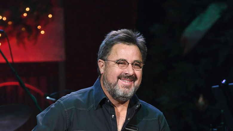 Vince Gill smiling on stage