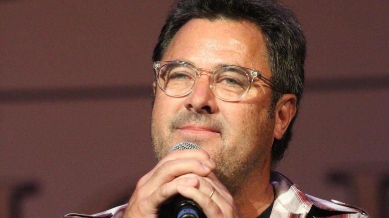 Vince Gill glasses speaking into mic