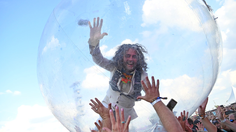 Wayne Coyne crowdsurfing in bubble