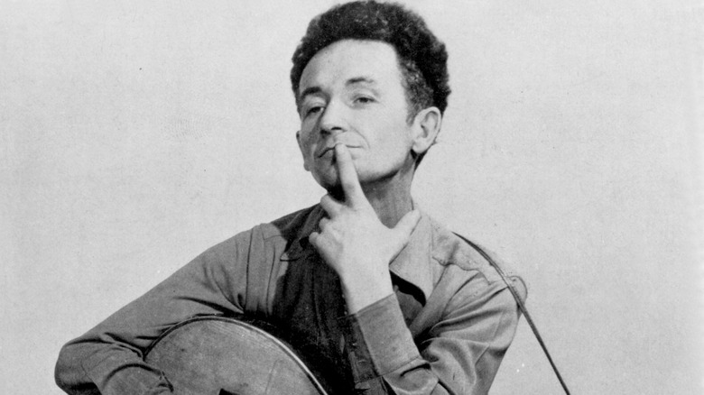 Woody Guthrie finger on chin