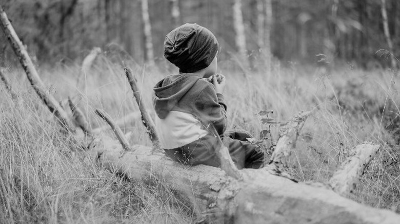 Boy alone woods