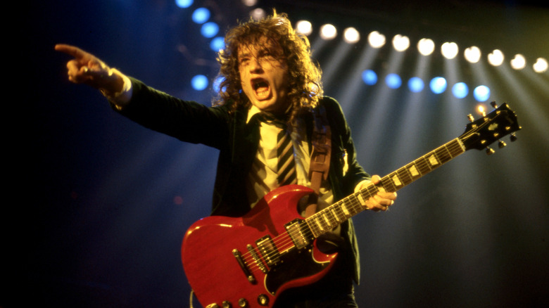 Angus Young performing with AC/DC