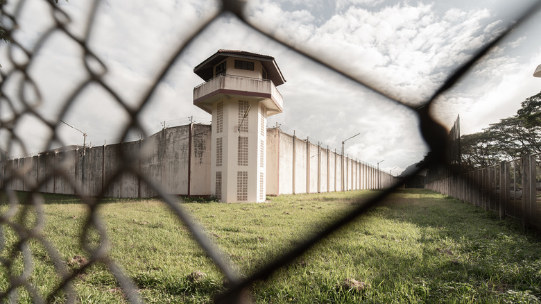 Prison seen through wire fence