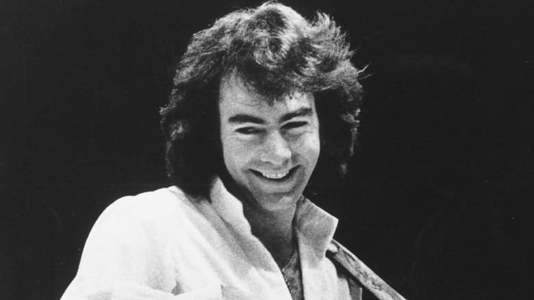 Neil Diamond with long hair and open shirt