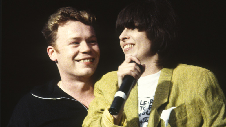 Ali Campbell smiling with Chrissie Hynde 
