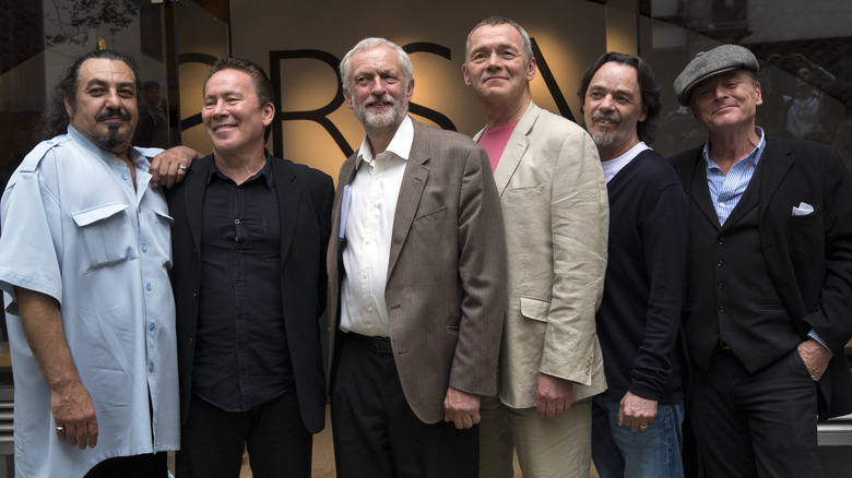 Present day members of UB40 with British politician Jeremy Corbyn