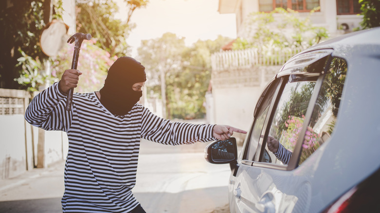 Carjacker with a hammer