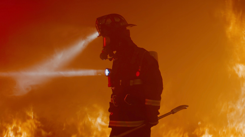 a firefighter in thick smoke