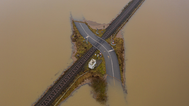 Flooded road and railroad track
