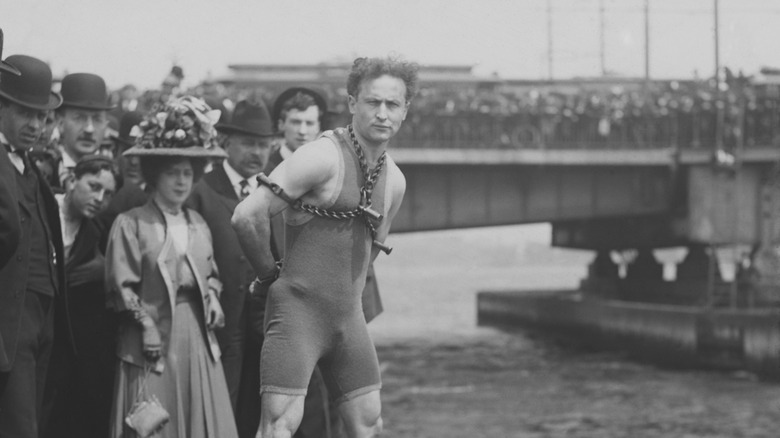 Harry Houdini in chains