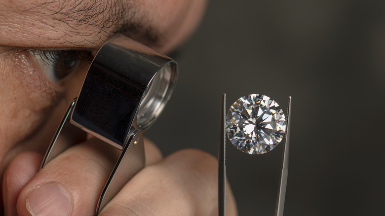 A jeweler inspecting a diamond