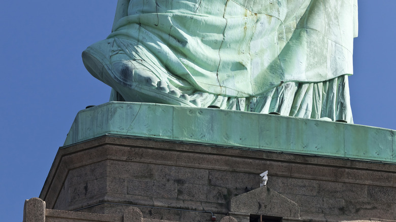 Statue of Liberty with foot raised