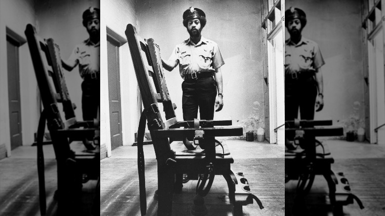 Prison guard with electric chair