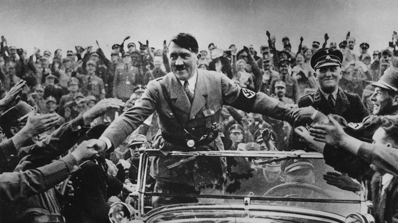 Adolf Hitler greets supporters