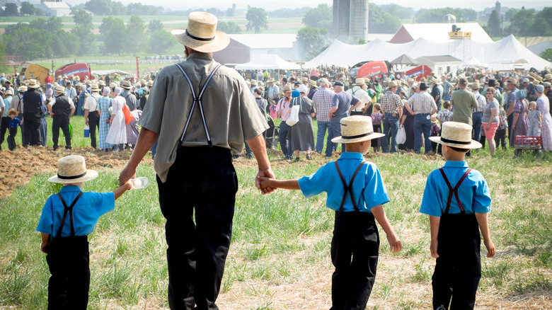 Amish family father and sons walking
