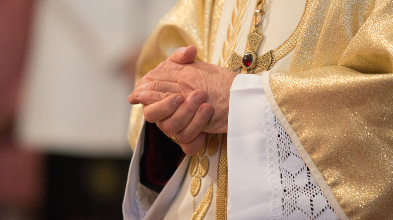 a priest's folded hands