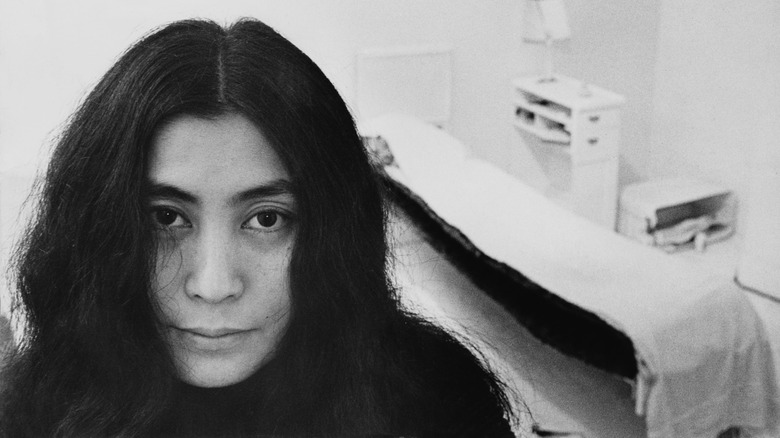 Yoko Ono posing