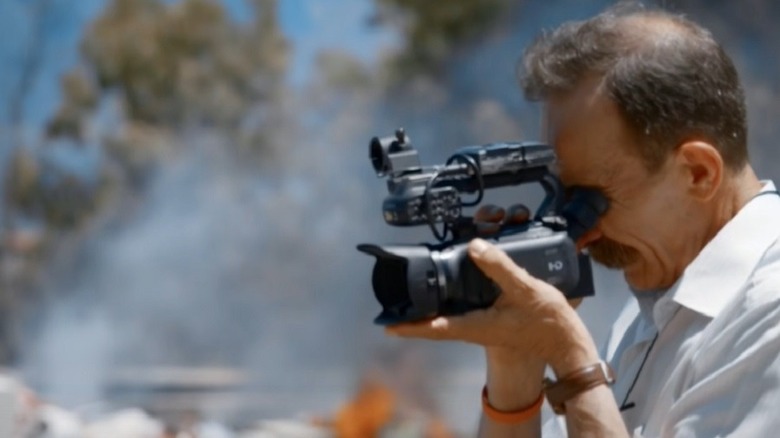 Pino Maniaci holding video camera