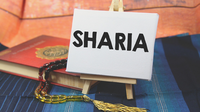 A placard with Sharia written on it