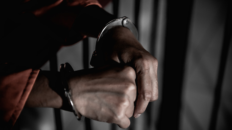 Woman's hands in handcuffs