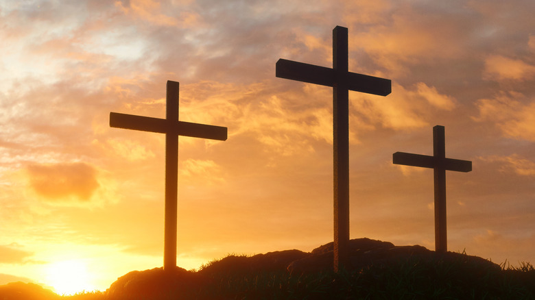 Christian crosses sunset orange clouds