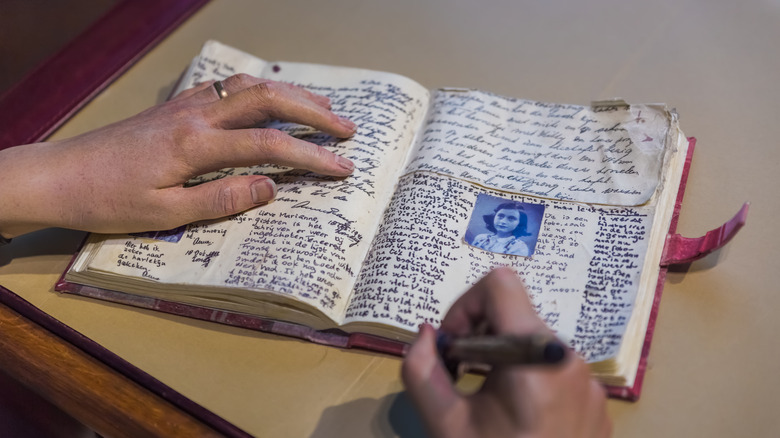 wax hand of Anne Frank writing