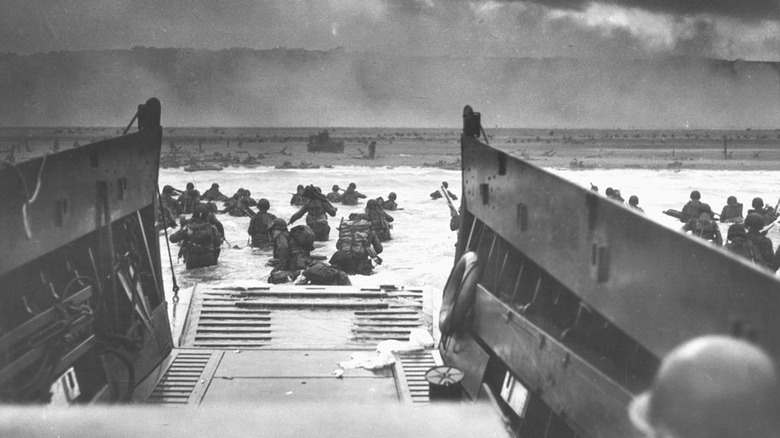 soldiers storming beach of normandy