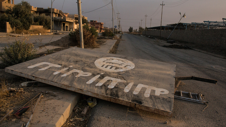 ISIS billboard lying in the street