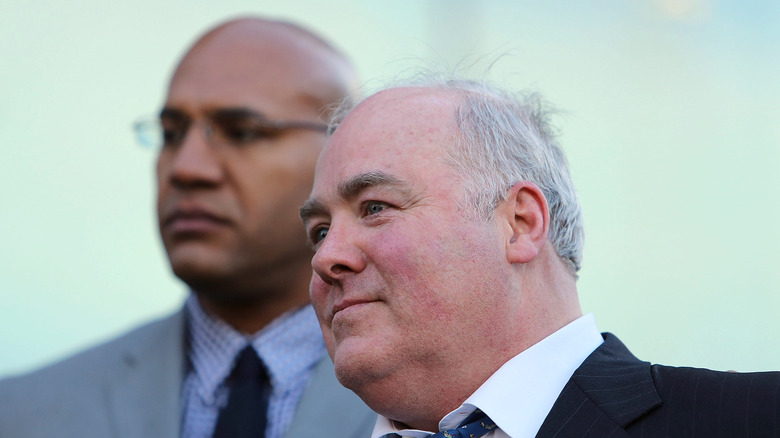 Michael Skakel smiling with man in background