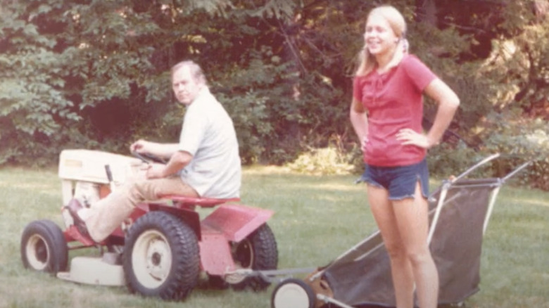 Martha Moxley with man on lawn mower