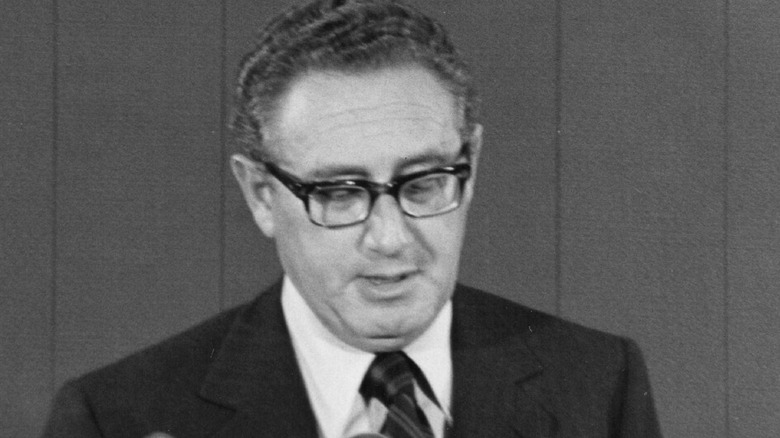 Henry Kissinger looking down