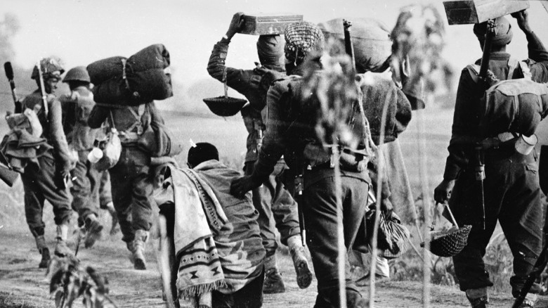 soldiers walking in field